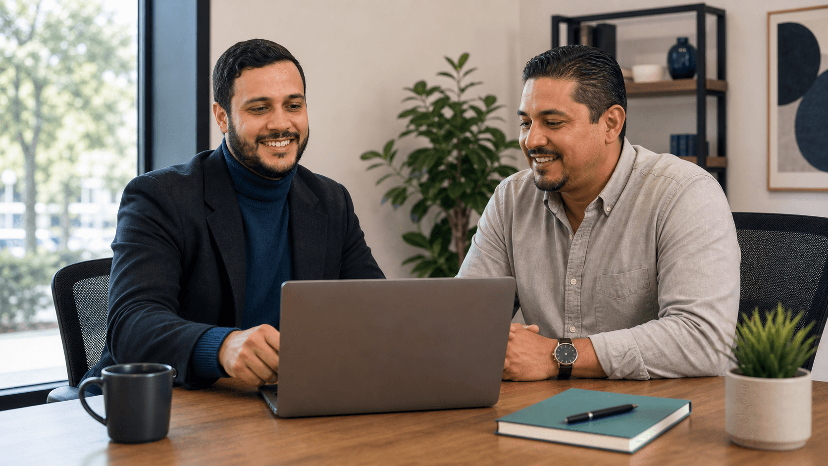 IT consultant meeting with a small business owner at an office table